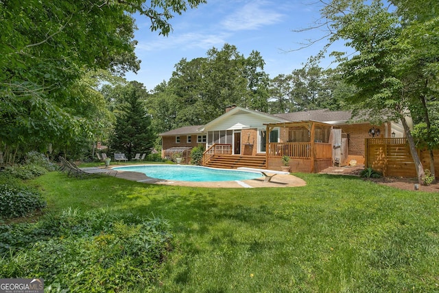 5401 Rosser Rd, Tucker, GA 30087 - outdoor pool with a wooden deck, a lawn, and a diving board