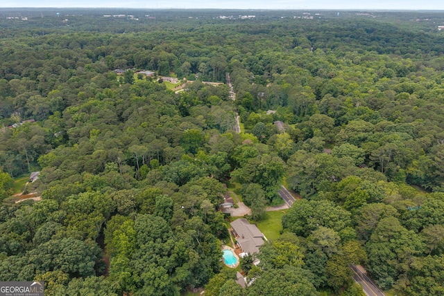 5401 Rosser Rd, Tucker, GA 30087 - aerial view of property and surrounding area featuring a heavily wooded area