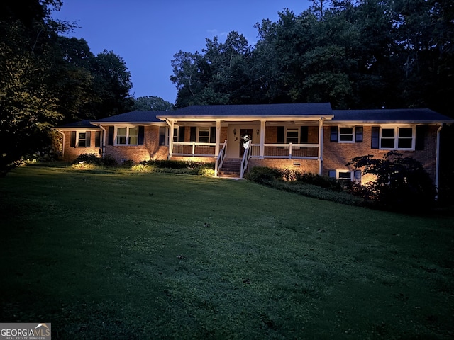 5401 Rosser Rd, Tucker, GA 30087 - ranch-style home with a porch, a front yard, and brick siding