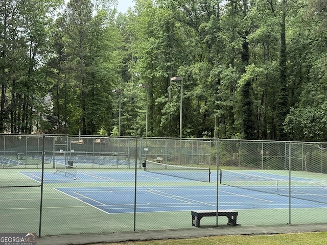 5401 Rosser Rd, Tucker, GA 30087 - view of tennis court featuring a wooded view
