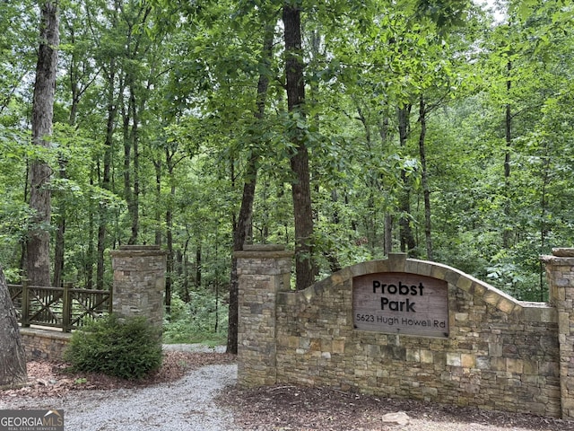 5401 Rosser Rd, Tucker, GA 30087 - community sign featuring a wooded view