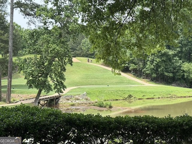 5401 Rosser Rd, Tucker, GA 30087 - surrounding community with a water view and a lawn