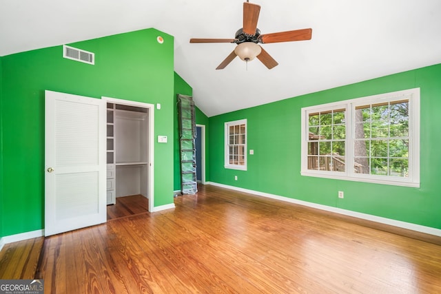 4624 Park Dr, Pine Lake, GA 30072 - unfurnished bedroom with wood finished floors, a closet, baseboards, high vaulted ceiling, and ceiling fan