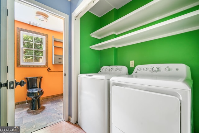 4624 Park Dr, Pine Lake, GA 30072 - laundry room with washing machine and clothes dryer and stone tile floors