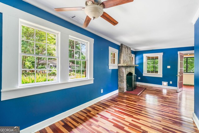 4624 Park Dr, Pine Lake, GA 30072 - unfurnished living room with baseboards, wood finished floors, ornamental molding, and a fireplace