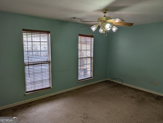5700 Miles Rd, South Fulton, GA 30349 - unfurnished room with ceiling fan, carpet flooring, a textured ceiling, and baseboards