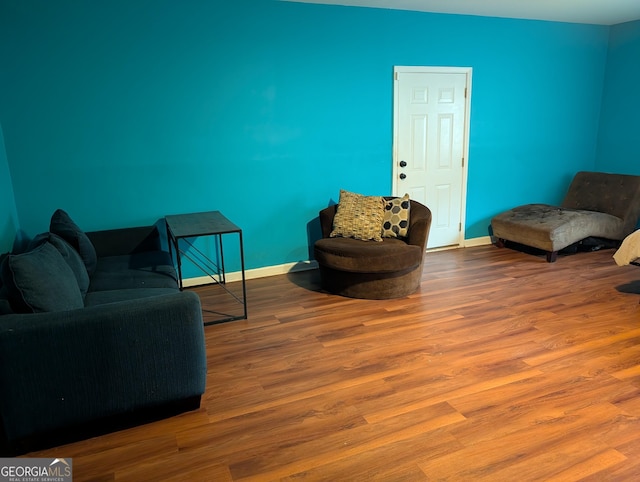 5700 Miles Rd, South Fulton, GA 30349 - living room featuring baseboards and wood finished floors
