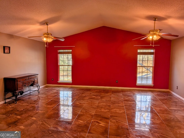 5700 Miles Rd, South Fulton, GA 30349 - unfurnished living room with a ceiling fan, marble finish floors, a textured ceiling, lofted ceiling, and baseboards