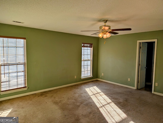 5700 Miles Rd, South Fulton, GA 30349 - carpeted empty room with a textured ceiling, a ceiling fan, and baseboards
