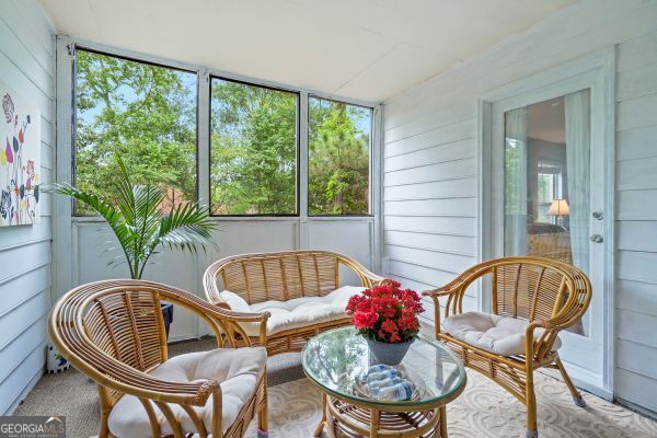 212 Brittany Ct, Duluth, GA 30096 - sunroom / solarium featuring plenty of natural light and wooden walls