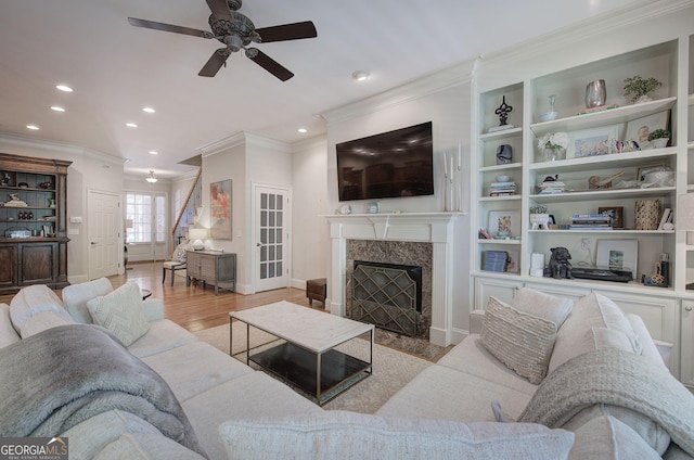 5492 Glenridge Dr Unit 536, Atlanta, GA 30342 - living area featuring ornamental molding, ceiling fan, recessed lighting, wood finished floors, and baseboards