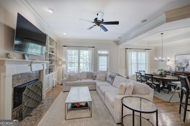 5492 Glenridge Dr Unit 536, Atlanta, GA 30342 - living area with plenty of natural light, crown molding, a ceiling fan, and wood finished floors