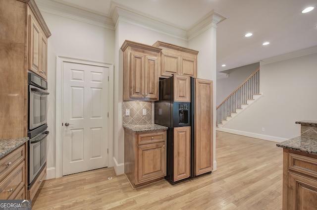5492 Glenridge Dr Unit 536, Atlanta, GA 30342 - kitchen with fridge with ice dispenser, light wood-style floors, ornamental molding, tasteful backsplash, and baseboards