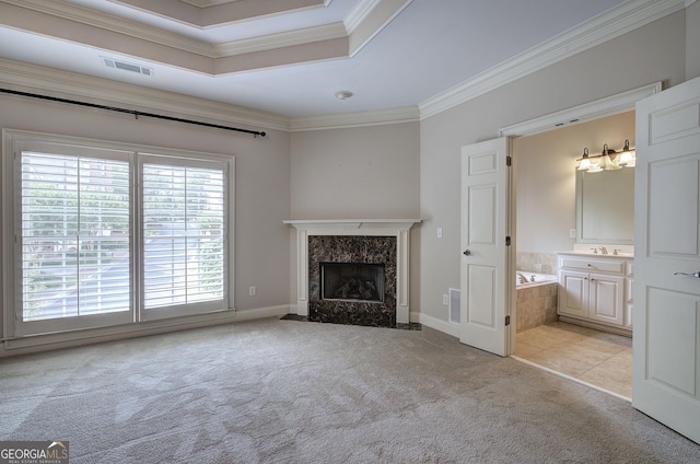 5492 Glenridge Dr Unit 536, Atlanta, GA 30342 - unfurnished living room with light carpet, ornamental molding, a fireplace, baseboards, and a sink
