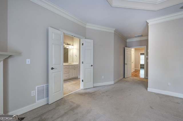 5492 Glenridge Dr Unit 536, Atlanta, GA 30342 - unfurnished bedroom with ornamental molding, carpet floors, baseboards, and connected bathroom