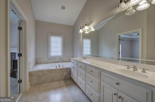 5492 Glenridge Dr Unit 536, Atlanta, GA 30342 - bathroom with double vanity, a bath, vaulted ceiling, and tile patterned flooring