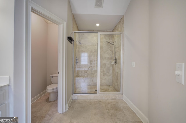 5492 Glenridge Dr Unit 536, Atlanta, GA 30342 - bathroom with toilet, a shower stall, baseboards, vanity, and recessed lighting