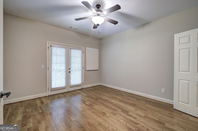 5492 Glenridge Dr Unit 536, Atlanta, GA 30342 - empty room featuring french doors, baseboards, light wood finished floors, and ceiling fan