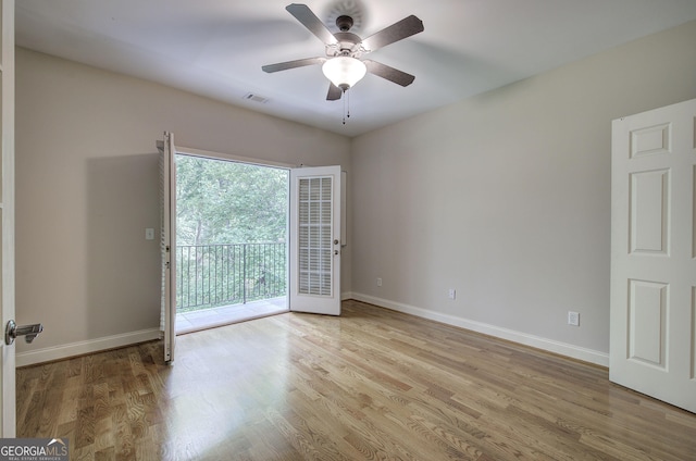 5492 Glenridge Dr Unit 536, Atlanta, GA 30342 - empty room with baseboards, wood finished floors, and ceiling fan