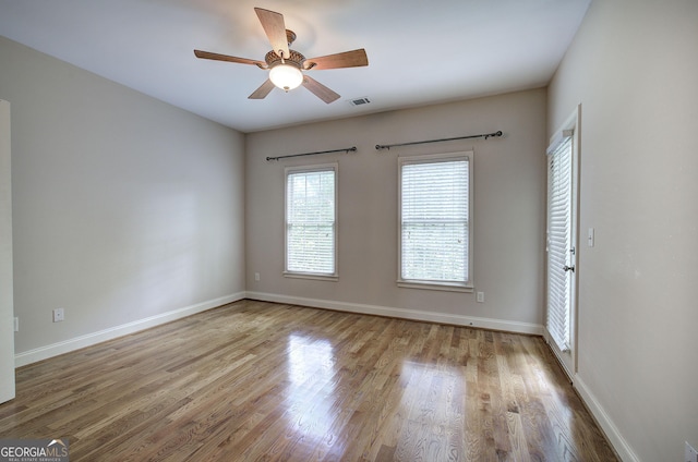 5492 Glenridge Dr Unit 536, Atlanta, GA 30342 - spare room featuring a ceiling fan, wood finished floors, and baseboards