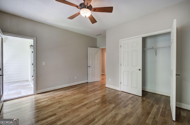5492 Glenridge Dr Unit 536, Atlanta, GA 30342 - unfurnished bedroom featuring wood finished floors, a closet, ceiling fan, and baseboards