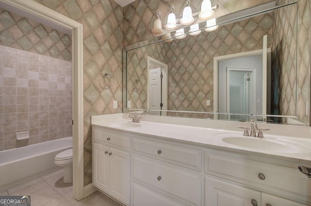 5492 Glenridge Dr Unit 536, Atlanta, GA 30342 - bathroom with toilet, double vanity, tile patterned flooring, and washtub / shower combination