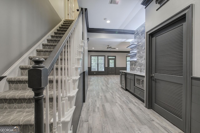 5492 Glenridge Dr Unit 536, Atlanta, GA 30342 - stairway featuring ornamental molding, a ceiling fan, wood finished floors, wine cooler, and recessed lighting