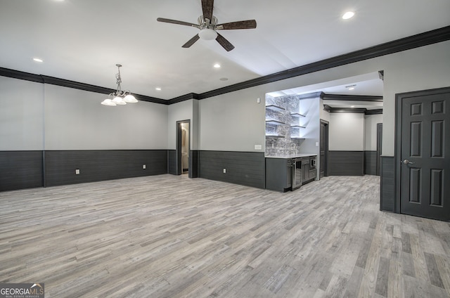 5492 Glenridge Dr Unit 536, Atlanta, GA 30342 - unfurnished living room featuring crown molding, wainscoting, a ceiling fan, light wood-style flooring, and recessed lighting