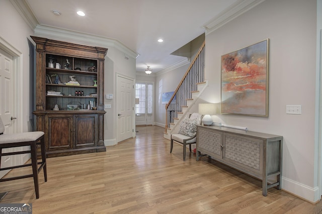 5492 Glenridge Dr Unit 536, Atlanta, GA 30342 - entrance foyer featuring ornamental molding, baseboards, stairway, light wood-type flooring, and recessed lighting