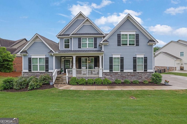 8745 Hightower Rdg, Ball Ground, GA 30107 - craftsman house with covered porch, stone siding, a standing seam roof, and a front yard
