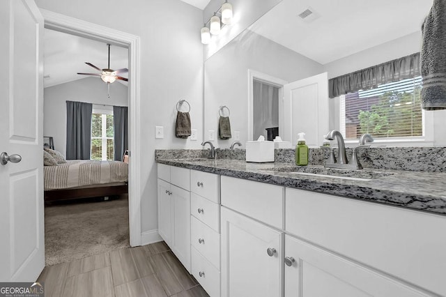 8745 Hightower Rdg, Ball Ground, GA 30107 - full bath with double vanity, a ceiling fan, lofted ceiling, and ensuite bathroom