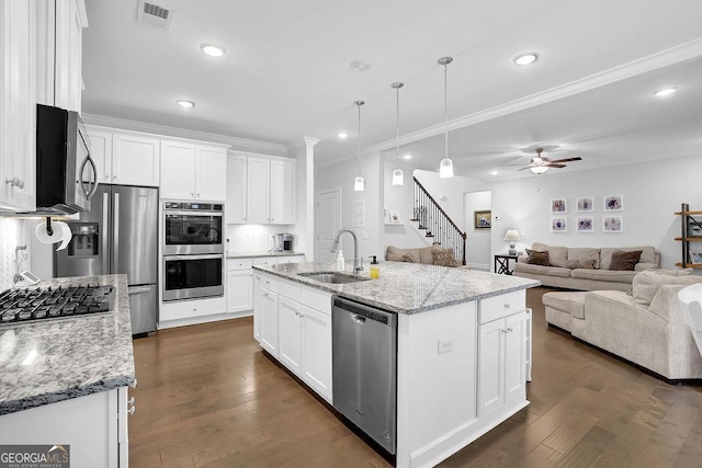 8745 Hightower Rdg, Ball Ground, GA 30107 - kitchen featuring appliances with stainless steel finishes, a sink, recessed lighting, white cabinets, and dark wood-style floors