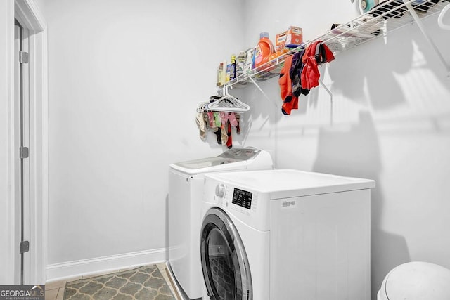 8745 Hightower Rdg, Ball Ground, GA 30107 - laundry area featuring separate washer and dryer and baseboards