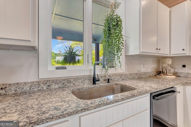 346 Rest Haven Rd, Thomaston, GA 30286 - kitchen with a sink, white cabinets, dishwasher, and light stone counters