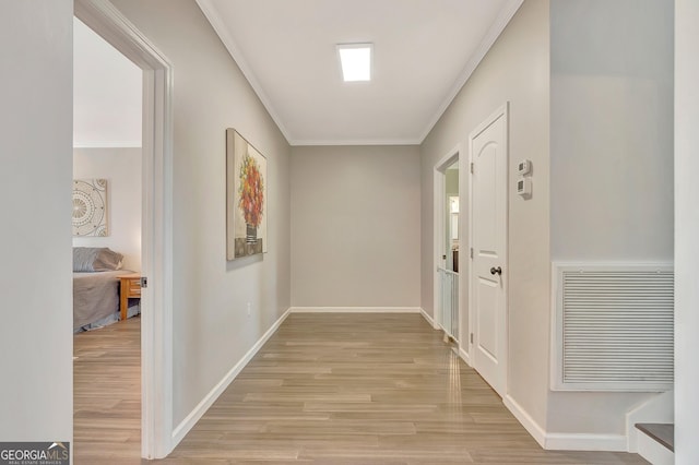 346 Rest Haven Rd, Thomaston, GA 30286 - corridor featuring ornamental molding, light wood finished floors, and baseboards