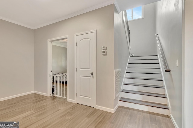 346 Rest Haven Rd, Thomaston, GA 30286 - stairs featuring wood finished floors, crown molding, and baseboards
