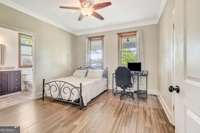 346 Rest Haven Rd, Thomaston, GA 30286 - bedroom featuring an office area, light wood-style floors, multiple windows, ornamental molding, and ensuite bath