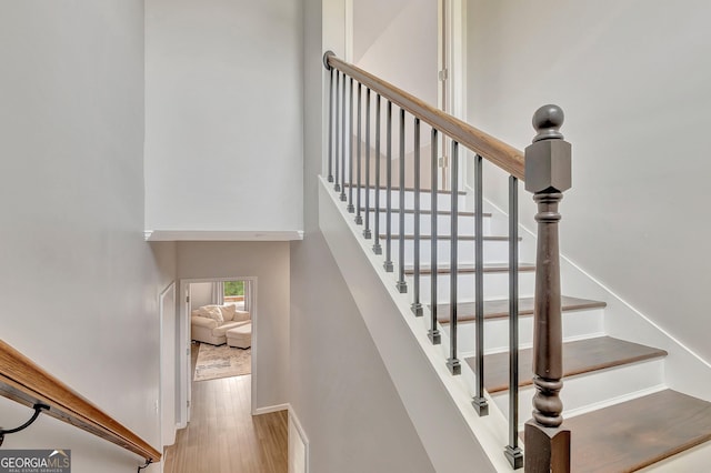 346 Rest Haven Rd, Thomaston, GA 30286 - stairway with wood finished floors, baseboards, and a high ceiling