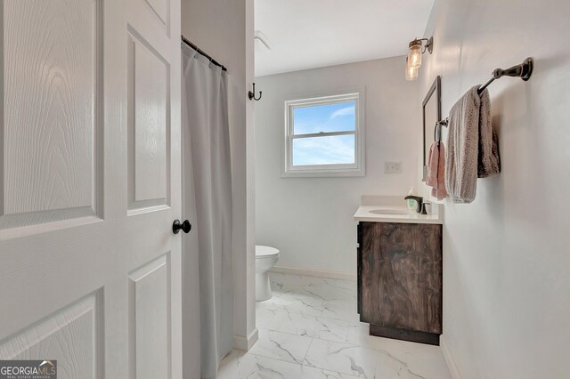 346 Rest Haven Rd, Thomaston, GA 30286 - full bath featuring baseboards, marble look tile flooring, toilet, vanity, and a shower with curtain
