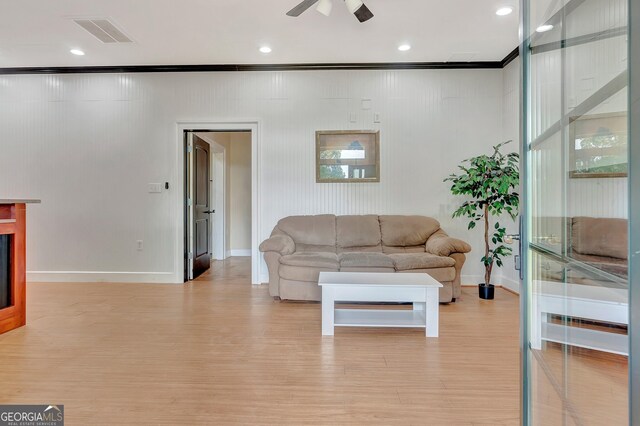 346 Rest Haven Rd, Thomaston, GA 30286 - living area featuring light wood-style floors, crown molding, baseboards, a ceiling fan, and recessed lighting