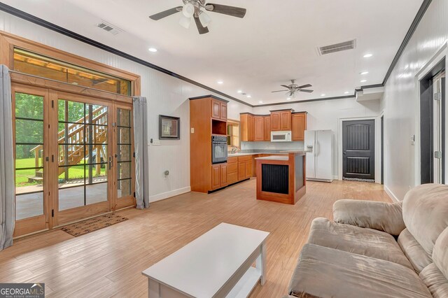 346 Rest Haven Rd, Thomaston, GA 30286 - living area featuring a ceiling fan, ornamental molding, baseboards, light wood-style flooring, and recessed lighting