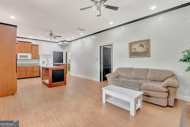 346 Rest Haven Rd, Thomaston, GA 30286 - living room featuring ceiling fan, crown molding, light wood-style flooring, baseboards, and recessed lighting