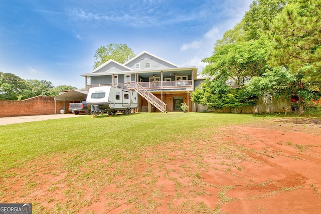 346 Rest Haven Rd, Thomaston, GA 30286 - rear view of property featuring stairway, a porch, a yard, a carport, and driveway