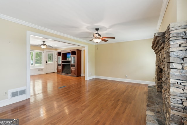 2055 Cactus Ln, Cumming, GA 30040 - unfurnished living room with ceiling fan, wood finished floors, and crown molding