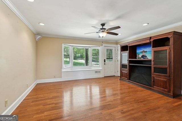 2055 Cactus Ln, Cumming, GA 30040 - unfurnished living room featuring crown molding, ceiling fan, wood finished floors, and recessed lighting