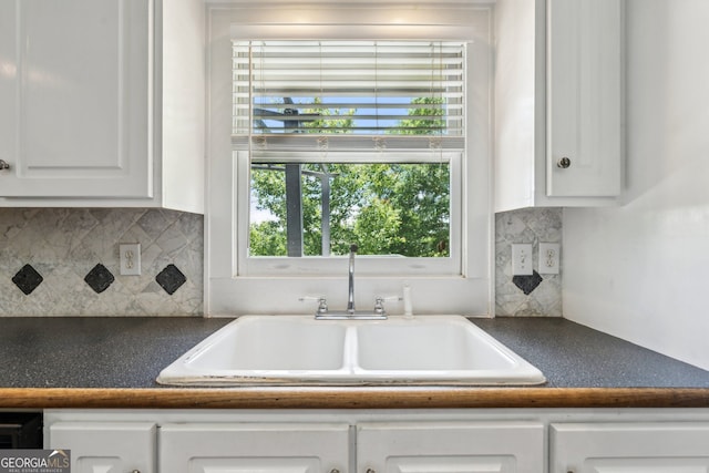 2055 Cactus Ln, Cumming, GA 30040 - kitchen with white cabinetry, dark countertops, and tasteful backsplash