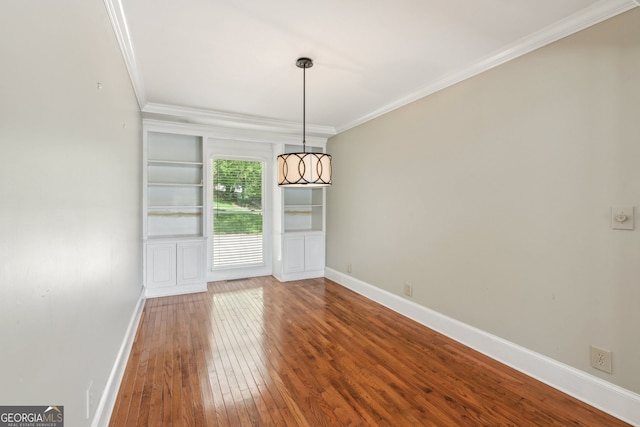 2055 Cactus Ln, Cumming, GA 30040 - unfurnished dining area with crown molding and wood-type flooring