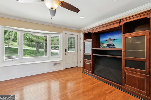 2055 Cactus Ln, Cumming, GA 30040 - unfurnished living room with crown molding, light wood-style floors, recessed lighting, and ceiling fan