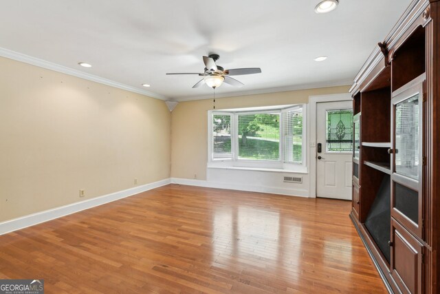 2055 Cactus Ln, Cumming, GA 30040 - empty room featuring crown molding, ceiling fan, light wood-style flooring, and recessed lighting