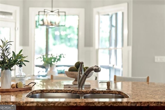 1286 Whisper Cove Dr, Buford, GA 30518 - kitchen featuring stone counters and a sink